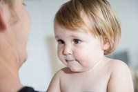 Baby looking at father